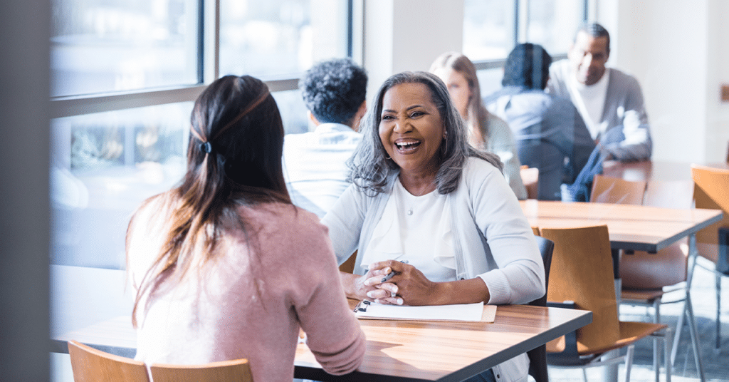 University advisor helping prospective student through their financial aid process.