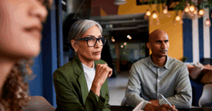 Higher education leader working with team